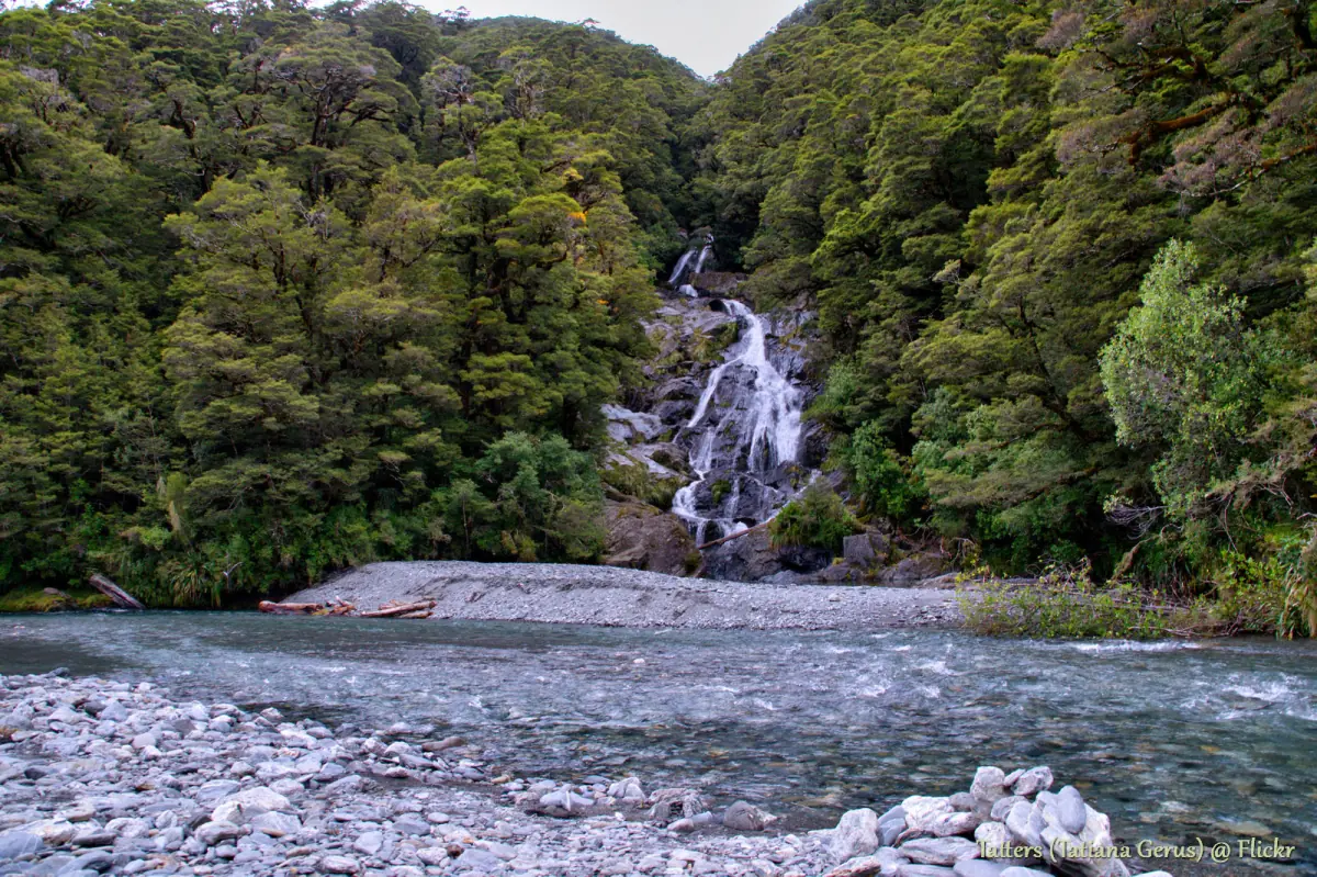 Fantail Falls seen across the river stones