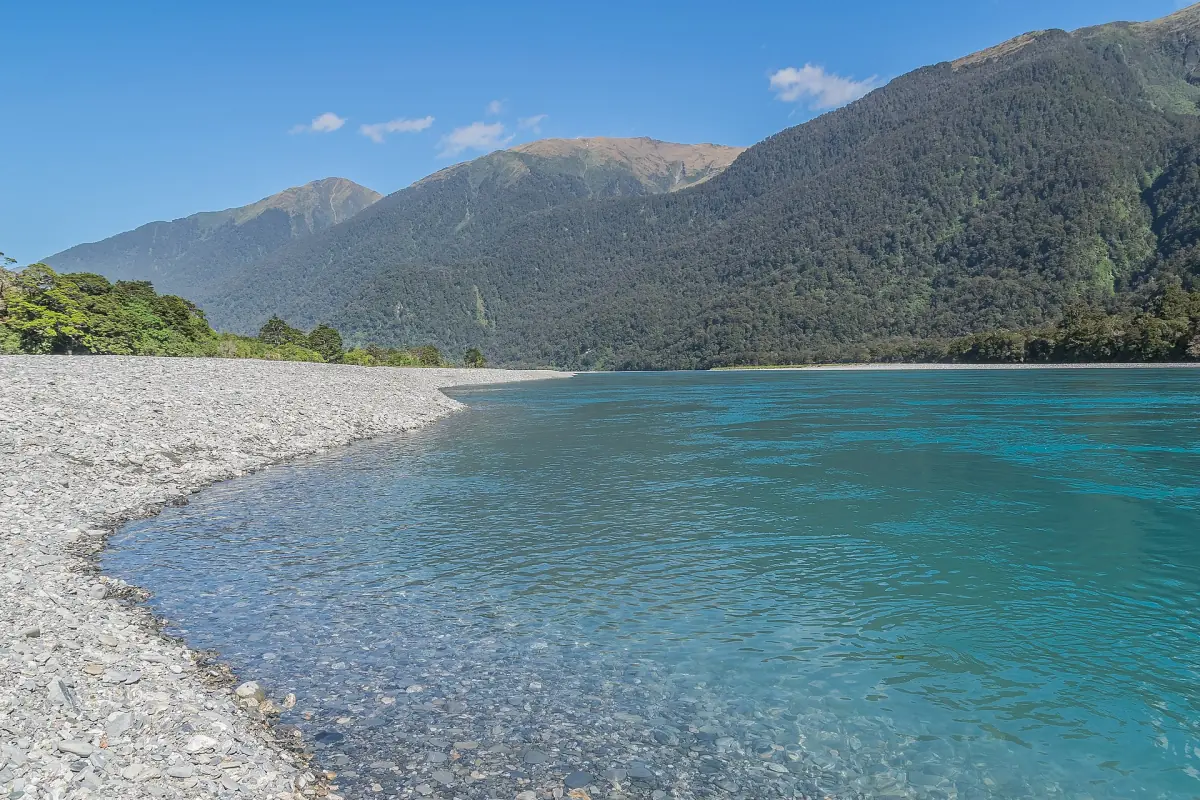 The turquoise Haast River below mountains